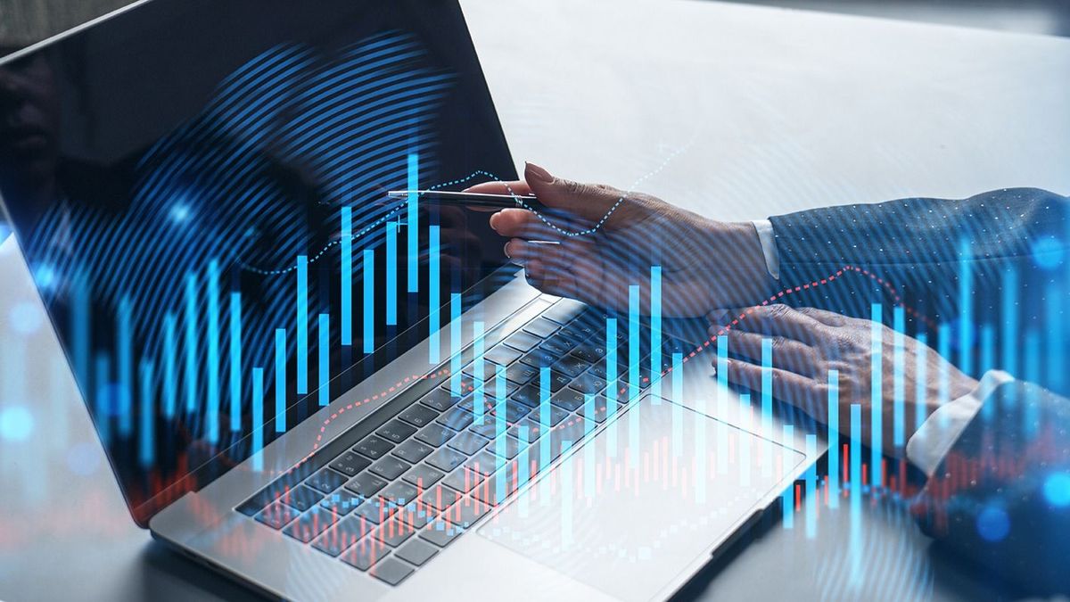 Two business people working together on stock market strategy. Try to analyze forex behavior. Financial graph hologram. Double exposure.