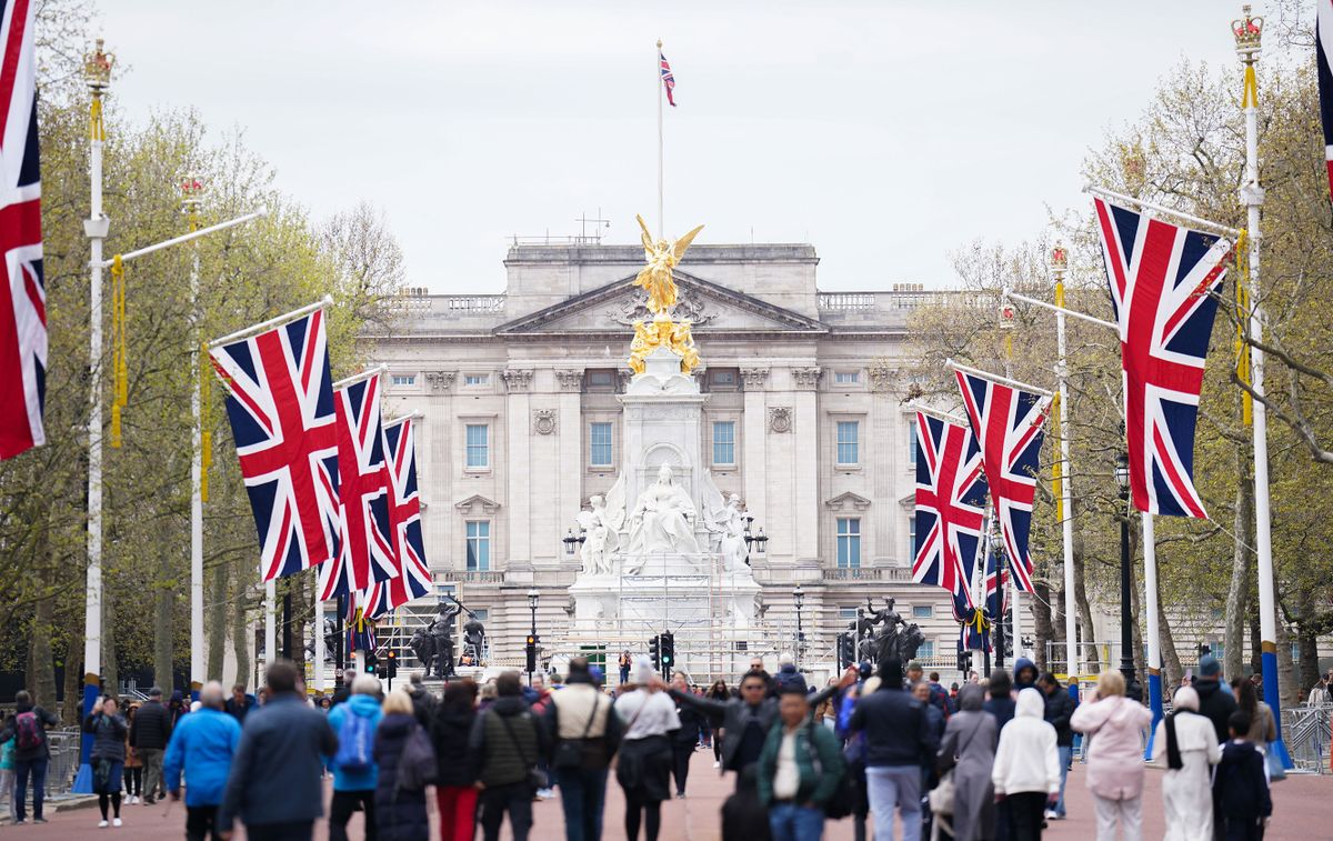 Union flags hang from the street furniture outside Buckingham Palace on the Mall, London as ireparations are underway across the UK for the coronation of King Charles III on May 6. Picture date: Wednesday April 26, 2023. 