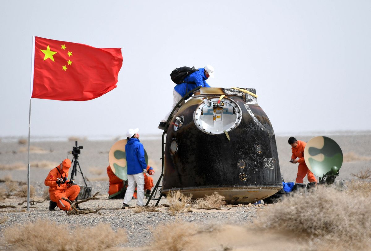 XINHUA-PICTURES OF THE YEAR 2022-CHINA NEWS (230109) -- BEIJING, Jan. 9, 2023 (Xinhua) -- The return capsule of the Shenzhou-13 manned spaceship lands successfully at the Dongfeng landing site in north China's Inner Mongolia Autonomous Region, April 16, 2022. (Xinhua/Peng Yuan) (Photo by Peng Yuan / XINHUA / Xinhua via AFP)