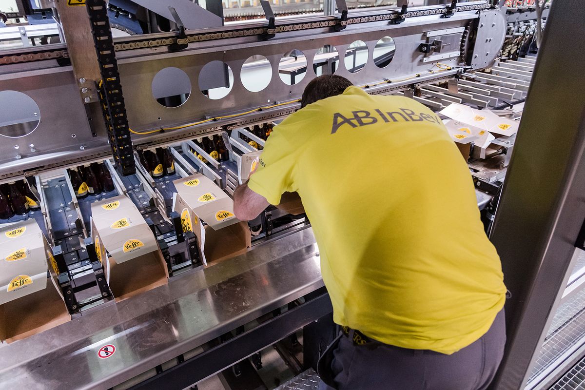 Anheuser-Busch InBev NV Headquarter Brewery Ahead of Earnings
An employee prepares packing boxes for bottles of Leffe Blonde beer in the Anheuser-Busch InBev NV brewery in Leuven, Belgium, on Wednesday, July 17, 2019. The worlds largest brewer reports half year earnings on July 24. Photographer: Geert Vanden Wijngaert/Bloomberg via Getty Images