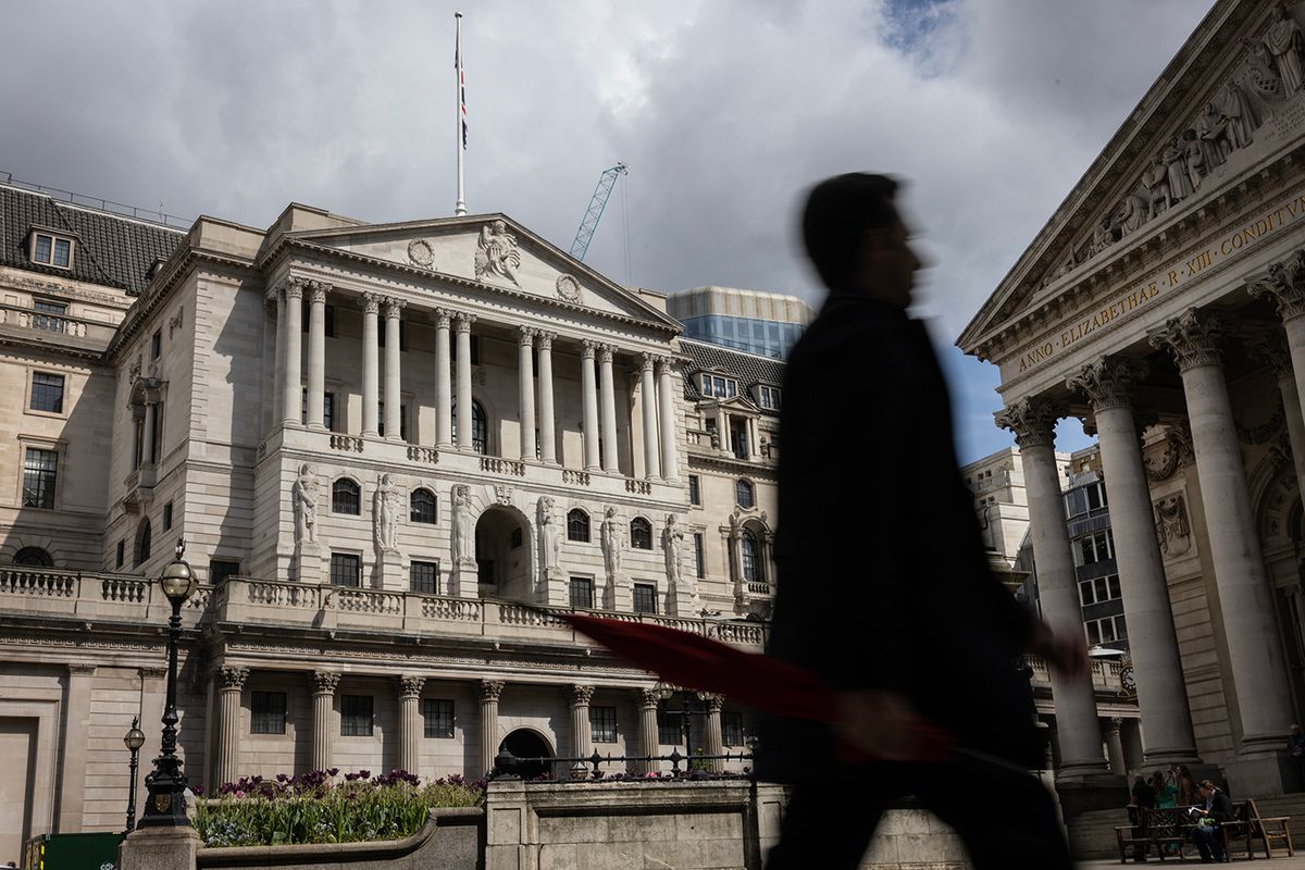 Bank Of England Announces Interest Rate RiseLONDON, ENGLAND - MAY 11: A man holding an umbrella walks past the Bank of England ahead of the central banks interest rate announcement on May 11, 2023 in London, England. The country's central bank has been steadily raising interest rates since last December to help curb the UK's persistent inflation. (Photo by Dan Kitwood/Getty Images)