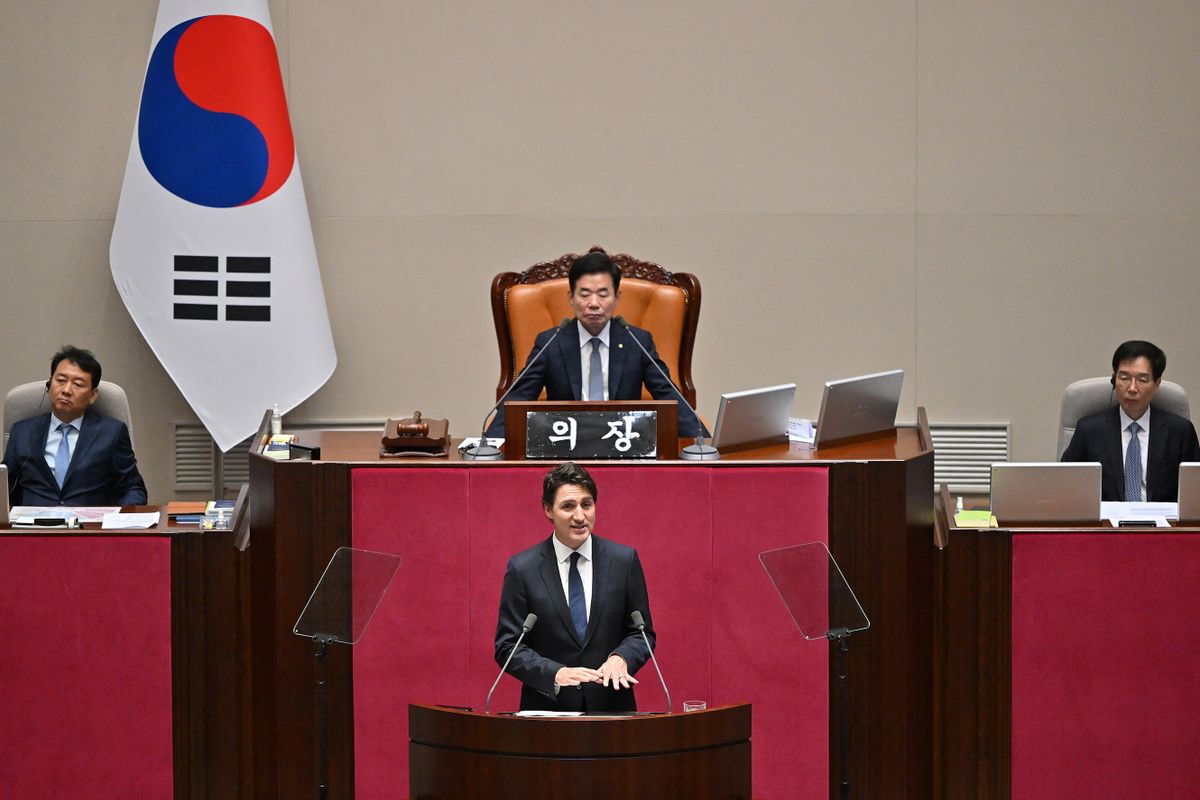 Canadian Prime Minister Justin Trudeau (bottom) delivers a speech at the National Assembly in Seoul on May 17, 2023. 