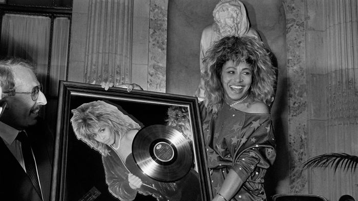 FILES-ENTERTAINMENT-MUSIC-US-SWITZERLAND(FILES) US singer Tina Turner receives the Golden record award from Pathe Marconi chairman Guy Deluz (L) on October 8, 1986, in Paris. Rock legend Tina Turner, the growling songstress who electrified audiences from the 1960s and went on to release hit records across five decades, has died at the age of 83, a statement announced on May 24, 2023. "It is with great sadness that we announce the passing of Tina Turner," read the statement on the official Instagram page of the eight-time Grammy winner. (Photo by Georges BENDRIHEM / AFP)