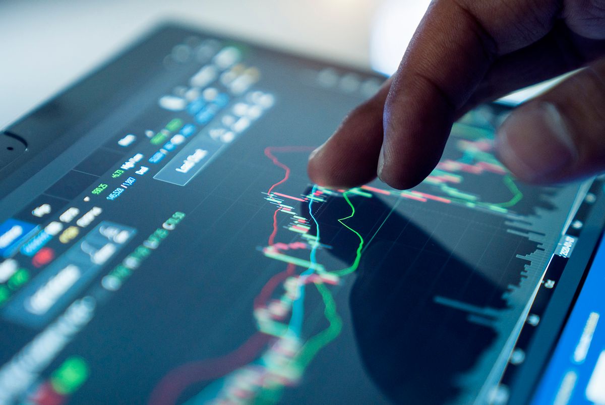 Market Analyze with Digital Monitor focus on tip of finger. Market Analyze with Digital Monitor focus on tip of finger.