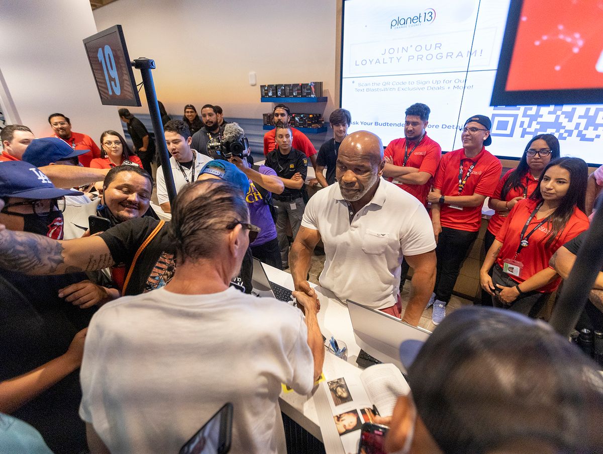 Mike Tyson
Santa Ana, CA - July 21:  Former heavyweight champion and cannabis entrepreneur Mike Tyson signs autographs and takes photos with fans while promoting his Tyson Ranch brand at Planet 13 dispensary in Santa Ana on Wednesday, July 21, 2021. (Allen J. Schaben / Los Angeles Times via Getty Images)