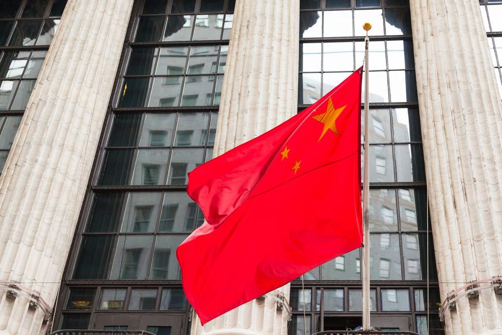Chinese,Flag,Floating,In,Front,Of,A,Government,Building