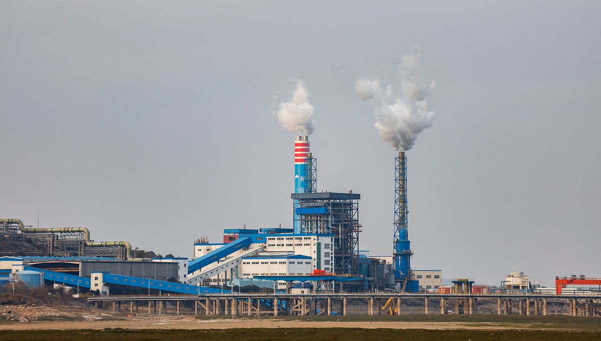 Jiujiang, China - Jan10, 2021: Smoky smokestacks at a chemical plant on the banks of Poyang Lake. China's carbon emission trading system (a national carbon market) has been put into operation.