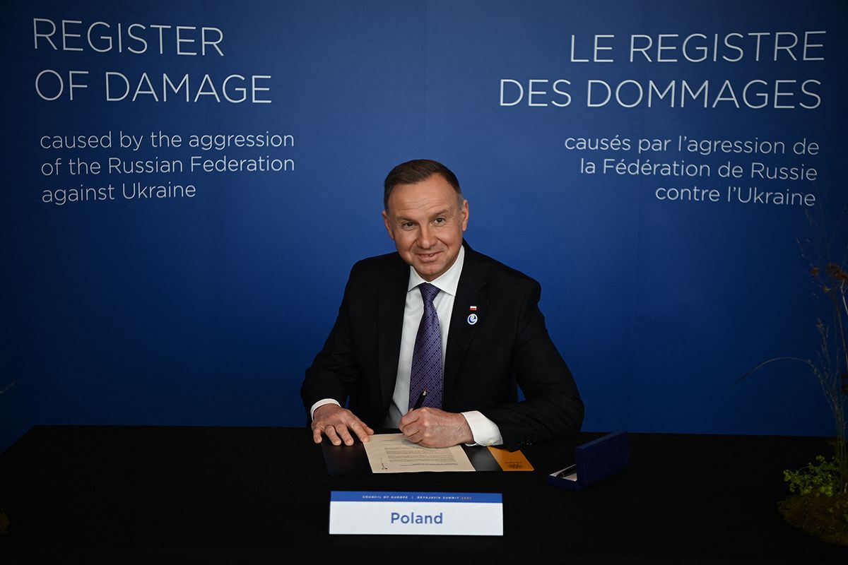 ICELAND-EU-POLITICS-SUMMIT-DIPLOMACY
Poland's President Andrzej Duda signs the agreement on the creation of a "Register of Damage caused by the aggression of the Russian Federation against Ukraine" on the sidelines of the 4th Summit of the Heads of State and Government of the Council of Europe, in Reykjavik, Iceland on May 17, 2023. A year after kicking Russia out of the Council of Europe (CoE) over its war in Ukraine, the leaders of the 46-nation pan-continental rights body is gathering for a two-day summit from May 16-17 in Iceland to take an initial step towards a future prosecution of Russian leaders. (Photo by Christophe ARCHAMBAULT / AFP)