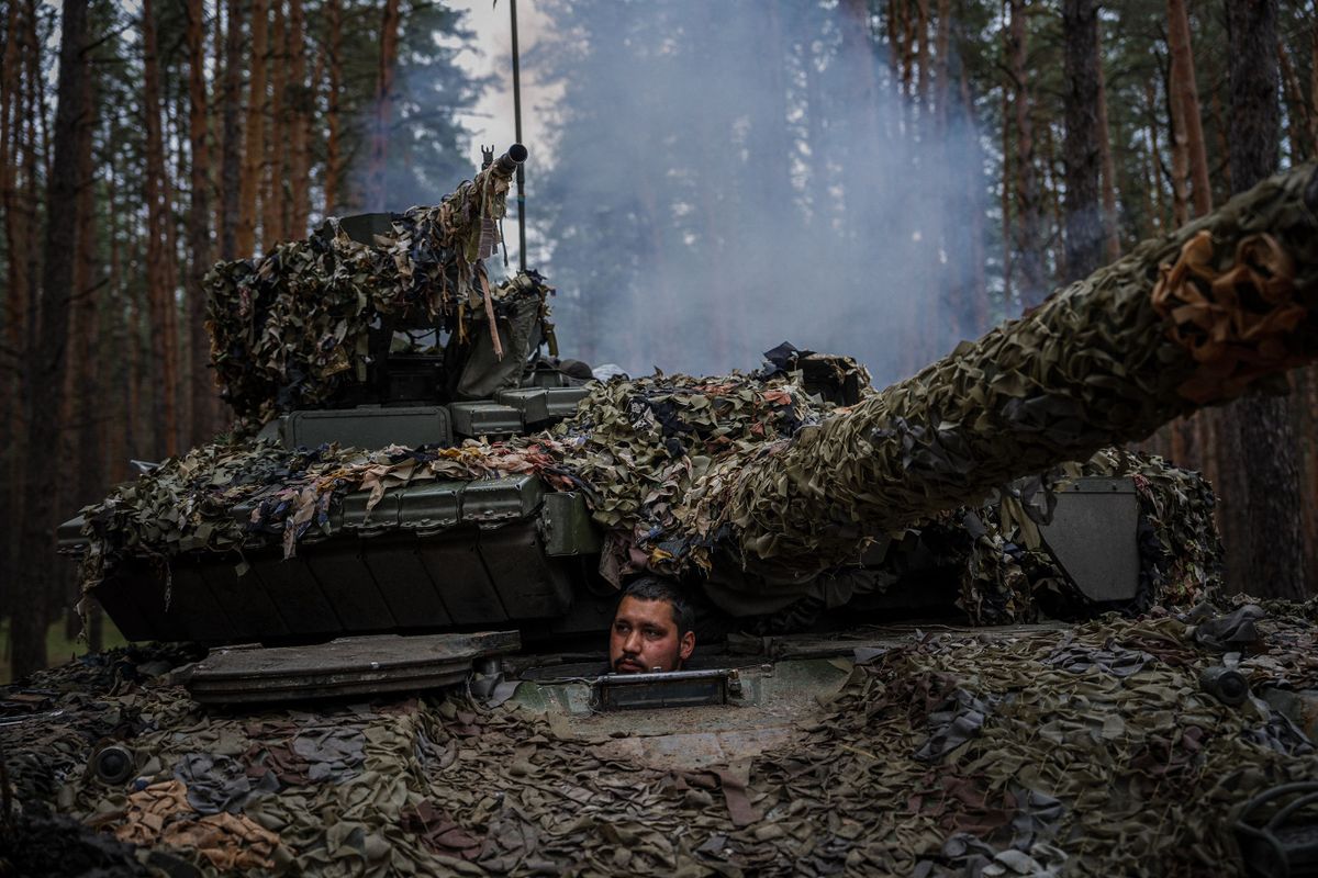 A Ukrainian tank sits inside his tank during a military exercise in the Kharkiv region on May 1, 2023, amid the Russian invasion of Ukraine.