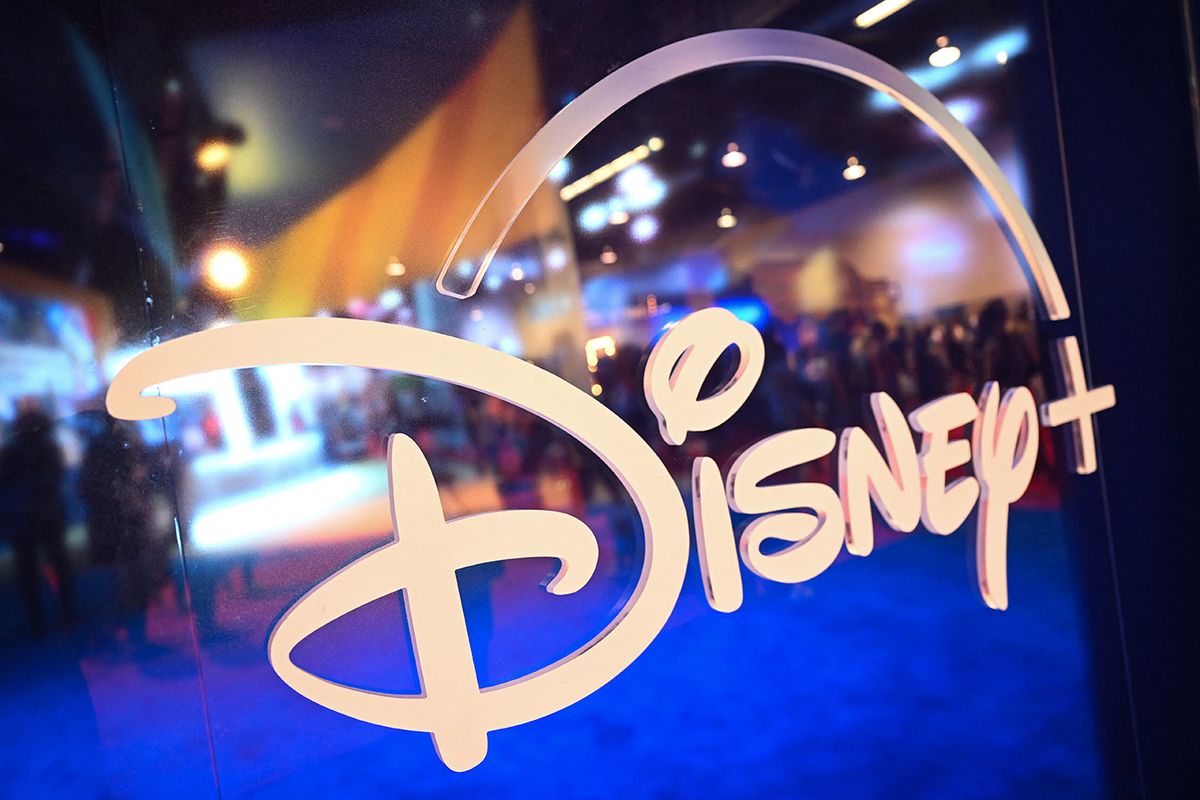 FILES-US-MEDIA-BUSINESS-DISNEY(FILES) This file picture taken on on September 9, 2022 shows fans are reflected in Disney+ logo during the Walt Disney D23 Expo in Anaheim, California. Subscribers to Disney Plus fell for the second straight quarter, the company said on May 10, 2023, though it stemmed financial losses as it competes with Netflix for viewers. (Photo by Patrick T. FALLON / AFP)