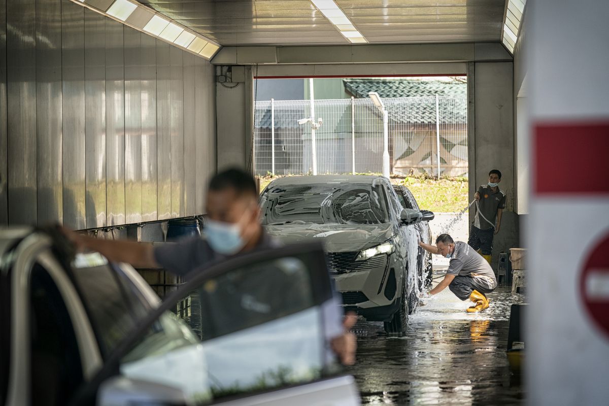 Car wash area at a Shell PLC service station in Singapore, on Monday, Aug. 22, 2022. As EV sales grow, Shell is reimagining the filling station as a place with coffee, snacks, and space to hang out while recharging the car. 