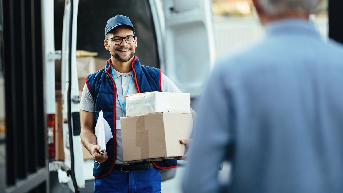Happy,Deliverer,Carrying,Packages,While,Making,Home,Delivery,To,His
Happy deliverer carrying packages while making home delivery to his customer. 