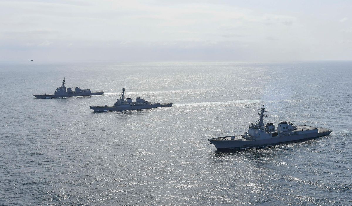 UNDISCLOSED LOCATION, AT SEA - APRIL 17: In this handout image released by the South Korean Defense Ministry, South Korean Navy's destroyer Yulgok Yi I (R), U.S. Navy's USS Benfold (C) and Japan Maritime Self-Defense Force's JS Atago (L) sail in formation during a joint naval exercise in international waters on April 17, 2023 at an undisclosed location. South Korea, the United States and Japan held a trilateral missile defense exercise in the international waters on Monday, Seoul's Navy said, amid stepped-up efforts to sharpen deterrence against North Korean threats. 