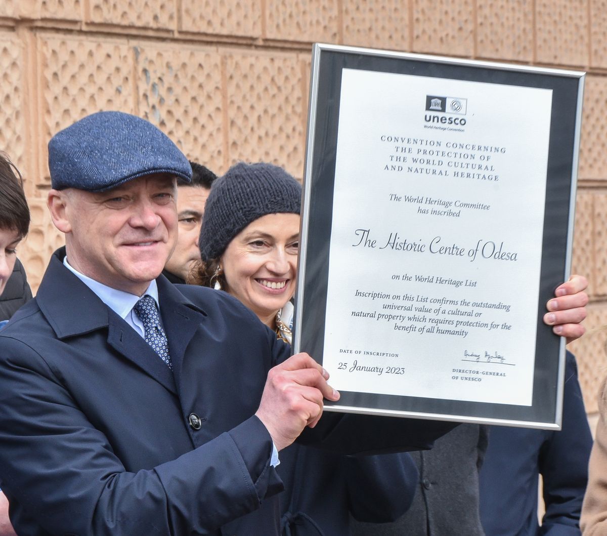 ODESA, UKRAINE - APRIL 04: UNESCO Director General Audrey Azoulay (not seen) and Mayor of Odesa Gennadiy Trukhanov (R) open a memorial plaque on the inclusion of the historical center of Odesa in the UNESCO World Heritage List during the ceremony in Odesa, Ukraine on April 4, 2023. As of current year, the old city center of Odesa in the southwest, which has been mostly spared damage in the conflict, is one of seven cultural monuments and one natural site in Ukraine that are on UNESCO's World Heritage List. (Photo by/Anadolu Agency via Getty Images)