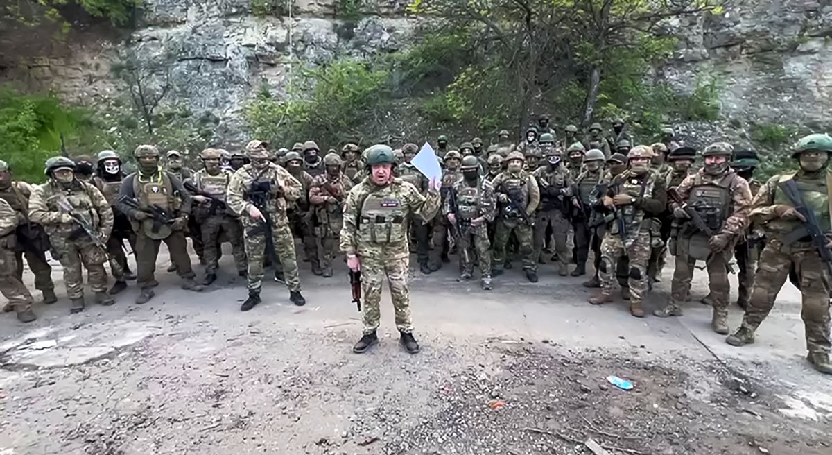 This video grab taken from a handout footage posted on May 5, 2023 on the Telegram account of the press-service of Concord -- a company linked to the chief of Russian mercenary group Wagner, Yevgeny Prigozhin -- shows Yevgeny Prigozhin addressing the Russian army's top brass standing in front of Wagner fighters at an undisclosed location. - The head of Russian paramilitary group Wagner on Friday threatened to pull his fighters from the front line in Bakhmut in eastern Ukraine on May 10, saying ammunition shortages meant they faced "senseless death". "On May 10, 2023 we will have to hand over our positions in Bakhmut to units of the defence ministry and withdraw Wagner units to rear camps to lick our wounds," Yevgeny Prigozhin said in a written statement on his Telegram channel. (Photo by Handout / TELEGRAM/ @concordgroup_official / AFP) / RESTRICTED TO EDITORIAL USE - MANDATORY CREDIT "AFP PHOTO /  Telegram channel of Concord group" - NO MARKETING - NO ADVERTISING CAMPAIGNS - DISTRIBUTED AS A SERVICE TO CLIENTS