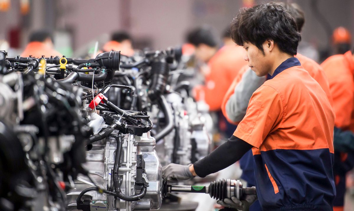 March 14, 2017, Linhai, Zhejiang Province, China, Geely Automobile Manufacturing Plant, assembly plant workers are assembling the engine, representing the highest level of China's state-owned car bran