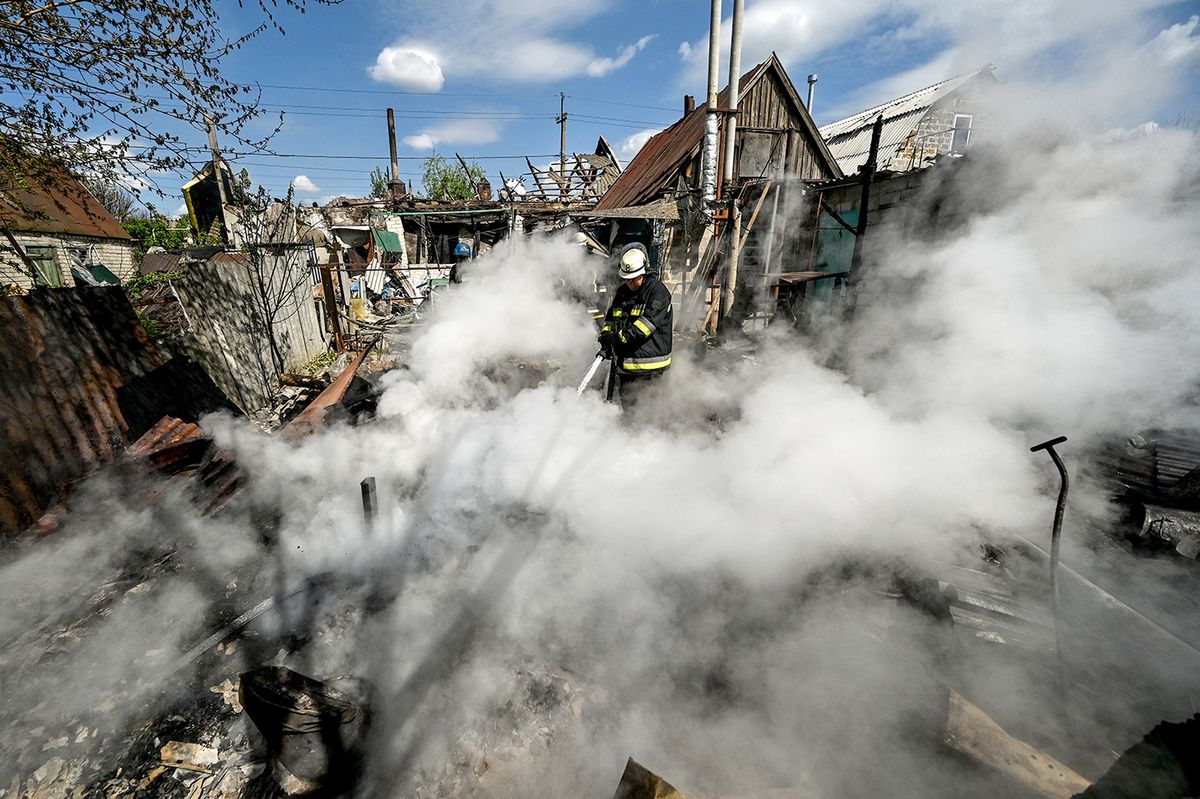 Russian military attacks Malokaterynivka
MALOKATERYNIVKA, UKRAINE - MAY 11, 2023 - A rescuer puts out the fire on the ruins of a house destroyed in the Russian MLRS attack on Malokaterynivka, Zaporizhzhia Region, southeastern Ukraine. As a result of the shelling which took place Wednesday evening, May 10, eight people sustained injuries from cluster shells, including three ambulance crew members who arrived at the scene of the attack.NO USE RUSSIA. NO USE BELARUS. (Photo by Dmytro Smolienko / NurPhoto / NurPhoto via AFP)