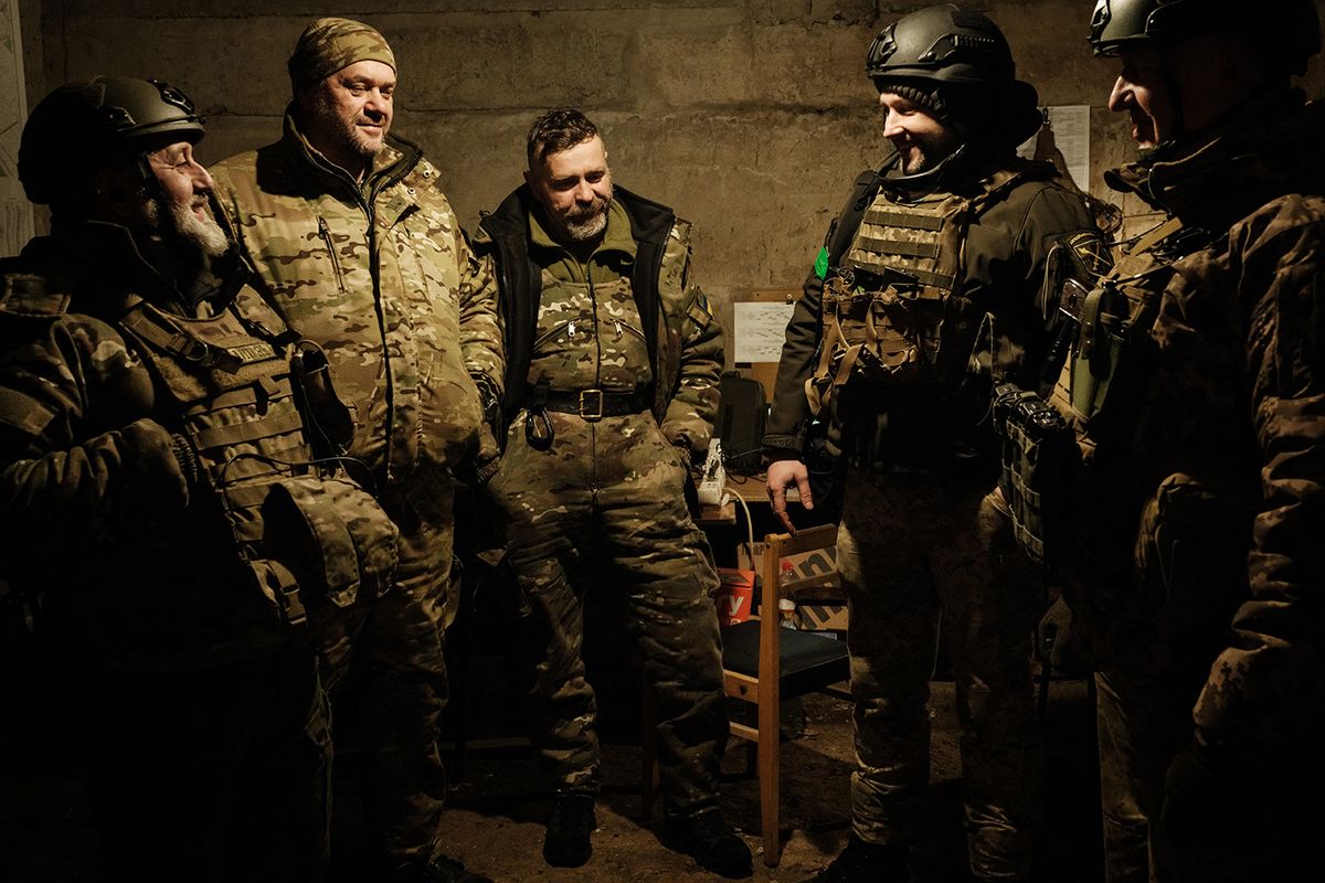 UKRAINE-RUSSIA-CONFLICT-WAR
Ukrainian servicemen of the State Border Guard Service talk in the shelter in Bakhmut on February 16, 2023, as the head of Russia's mercenary outfit Wagner said it could take months to capture the embattled Ukraine city and slammed Moscow's "monstrous bureaucracy" for slowing military gains. Russia has been trying to encircle the battered industrial city and wrest it ahead of February 24, the first anniversary of what it terms its "special military operation" in Ukraine. (Photo by YASUYOSHI CHIBA / AFP)