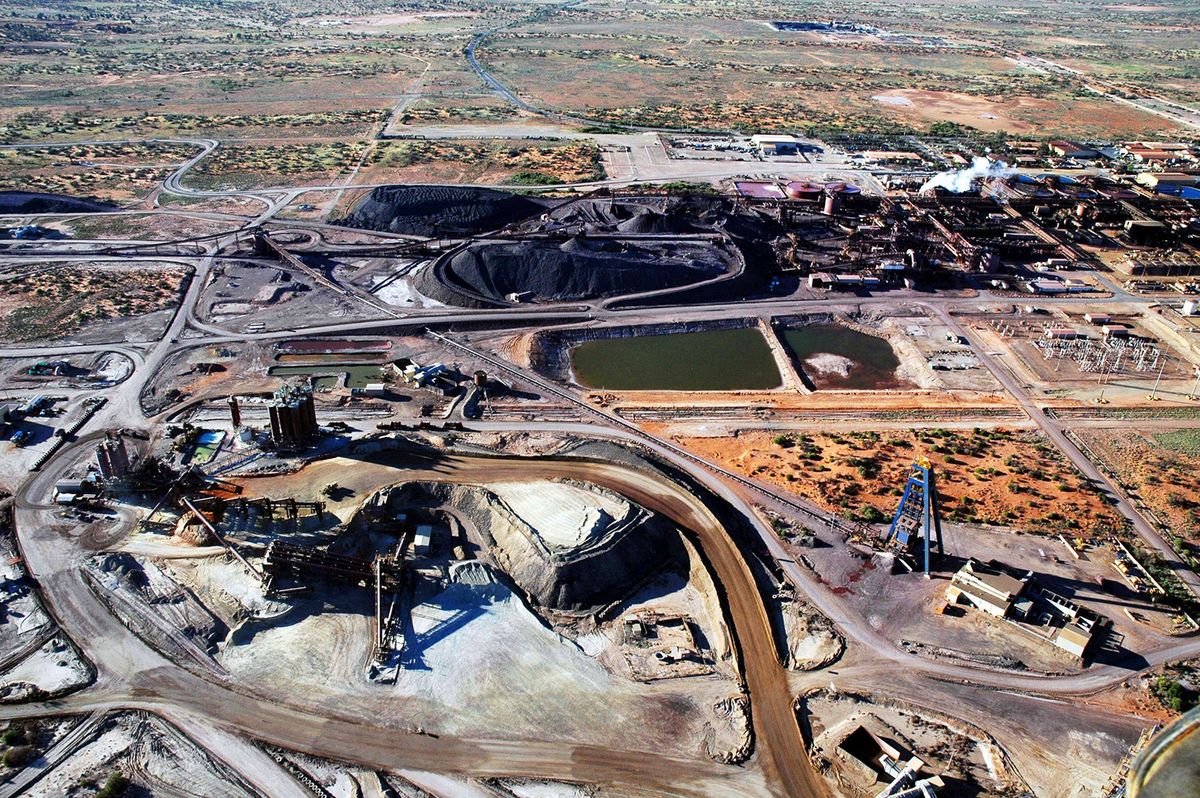 (FILES) This undated BHP Billiton handout photo received, 27 July 2006, shows an aerial view of the Olympic Dam copper and uranium mine in South Australia.  Prime Minister Tony Abbott on December 1, opened the door to the use of nuclear energy as Australia faces growing pressure to bring down its greenhouse gas emissions.  Australia is the world's third-ranking uranium producer behind Kazakhstan and Canada but does not use nuclear power, largely due to its abundance of low-cost coal and natural gas reserves, and community sentiment.  AFP PHOTO /BHP Billiton/SkyScans  ----EDITORS NOTE ----RESTRICTED TO EDITORIAL USE MANDATORY CREDIT " AFP PHOTO / BHP Billiton/SkyScans" NO MARKETING NO ADVERTISING CAMPAIGNS - DISTRIBUTED AS A SERVICE TO CLIENTS (Photo by AFP / BHP BILLITON/SKYSCANS / AFP)