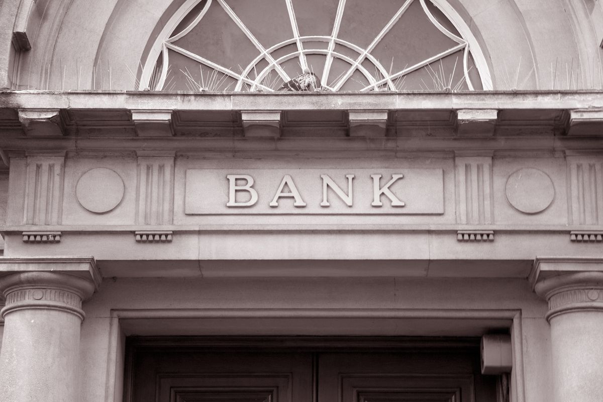 Bank,Sign,Over,Entrance,Door,In,Black,And,White,Sepia