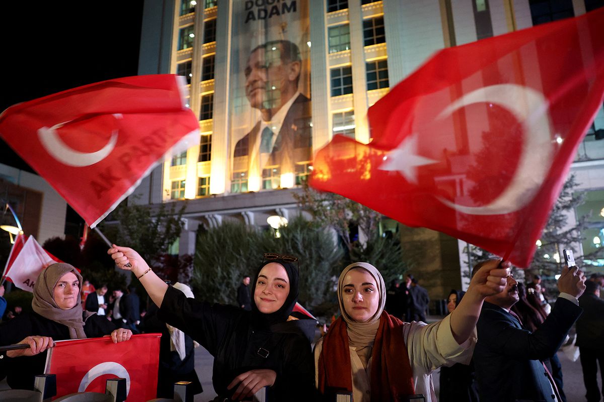 TURKEY-POLITICS-ELECTION-VOTE
Supporters of Turkish president and the ruling Justice and Development (AK) Party wave flags as they wait for the results of Turkey's general elections at the AK Party headquarters in Ankara, on May 14, 2023. (Photo by Adem ALTAN / AFP)