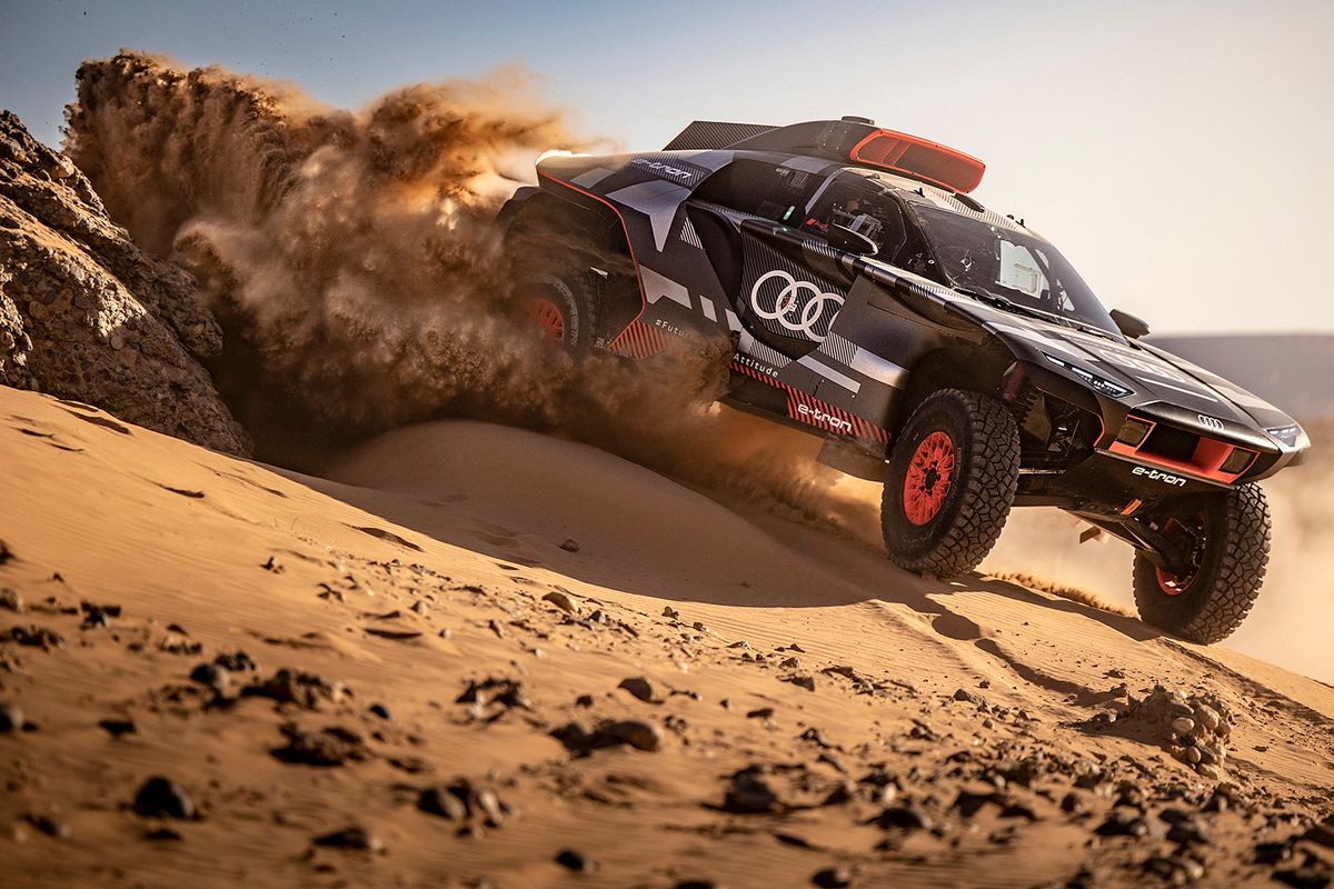 Carlos Sainz
Former champions and talented newcomers are gearing up to battle it out for rally glory at the Dakar Rally in Saudi Arabia in January 2022. It will take place across two weeks and will feature a new route that covers more than 8,000km of perilous terrain. Even the most experienced competitors will have to stay alert with more than 70 percent of tracks completely new for this race. Making its Dakar debut will be the Audi RS Q e-tron, with Audi Sport aiming to be the first to use an electrified drivetrain in combination with an efficient energy converter to compete for victory at the Dakar. Audi Sport have enlisted some of the best in the business to guide their new machine through the dunes. This includes 14-time Dakar champion Stéphane Peterhansel, legendary Spanish driver Carlos Sainz and former FIA World Rallycross champion Mattias Ekström. Representing Toyota Gazoo Racing will be two former champions, Qatar’s Nasser Al-Attiyah and South African Giniel de Villiers. Three-time Dakar winner Al-Attiyah is determined to be the first Middle Eastern driver to win the rally in his home region and will be racing the new-look Toyota Hilux T1+ model. Also bringing a T1+ car to the 2022 Dakar is nine-time WRC winner Sébastien Loeb. Making the switch from two wheels to four in Saudi Arabia is Laia Sanz. Five-time Dakar winner Cyril Despres will line up as part of the GEN Z project, whose eventual aim is to enter and win the Dakar in a fully hydrogen-powered vehicle. // Carlos Sainz seen during testing in Erfoud, Morocco on November 8, 2021 // Marcin Kin / Red Bull Content Pool (Photo by Marcin Kin / Red Bull Content Pool / Red Bull Content Pool via AFP)