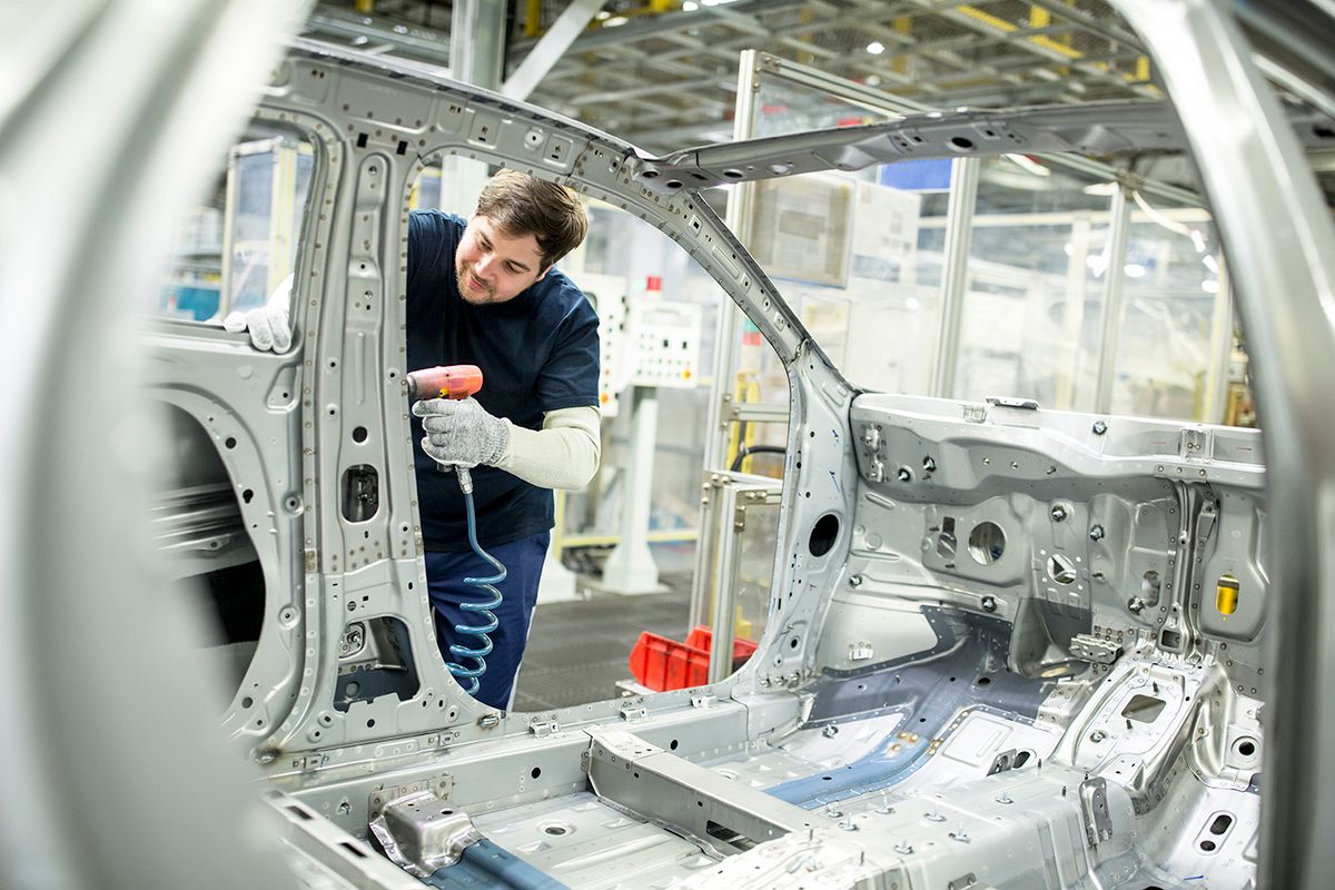 Man working in modern car factory