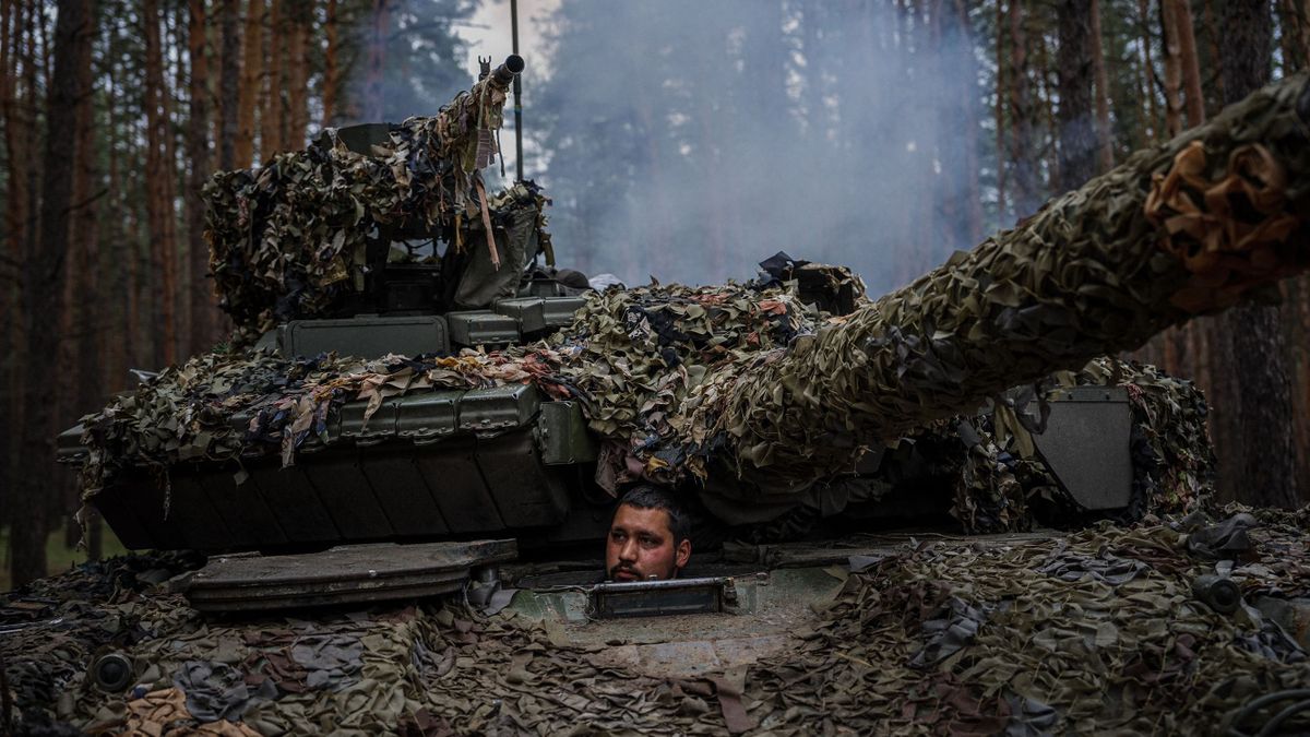 A Ukrainian tank sits inside his tank during a military exercise in the Kharkiv region on May 1, 2023, amid the Russian invasion of Ukraine.