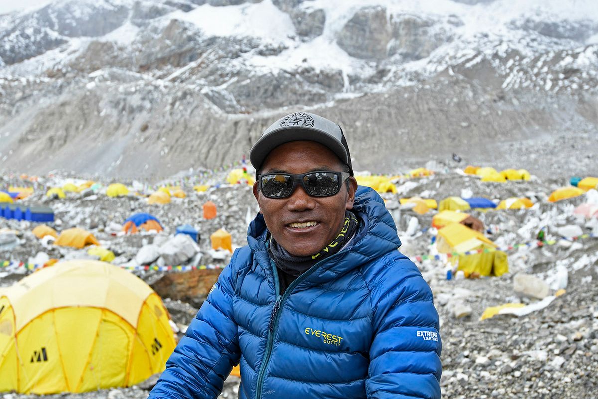 FILES-NEPAL-MOUNTAINEERING-EVEREST-RECORD
(FILES) In this file photo taken on May 2, 2021, Nepal's mountaineer Kami Rita Sherpa poses for a picture during an interview with AFP at the Everest base camp in the Mount Everest region of Solukhumbu district. Kami Rita Sherpa reached the top of Mount Everest for the 27th time on May 17, reclaiming the record for the most summits of the world's highest mountain. (Photo by Prakash MATHEMA / AFP)