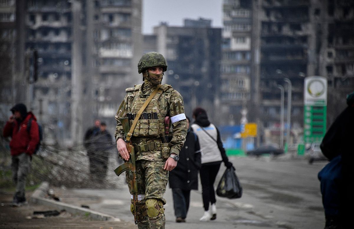 FILES-UKRAINE-RUSSIA-CONFLICT-MARIUPOL
(FILES) In this file photo taken on April 12, 2022 a Russian soldier patrols in a street of Mariupol, as Russian troops intensify a campaign to take the strategic port city, part of an anticipated massive onslaught across eastern Ukraine, while Russia's President makes a defiant case for the war on Russia's neighbour. Throughout the spring of 2022 one city represented the horrific suffering and catastrophic destruction caused by the war in Ukraine: Mariupol. Large parts of the city on the Sea of Azov were razed to the ground during a brutal three-month siege. (Photo by Alexander NEMENOV / AFP)