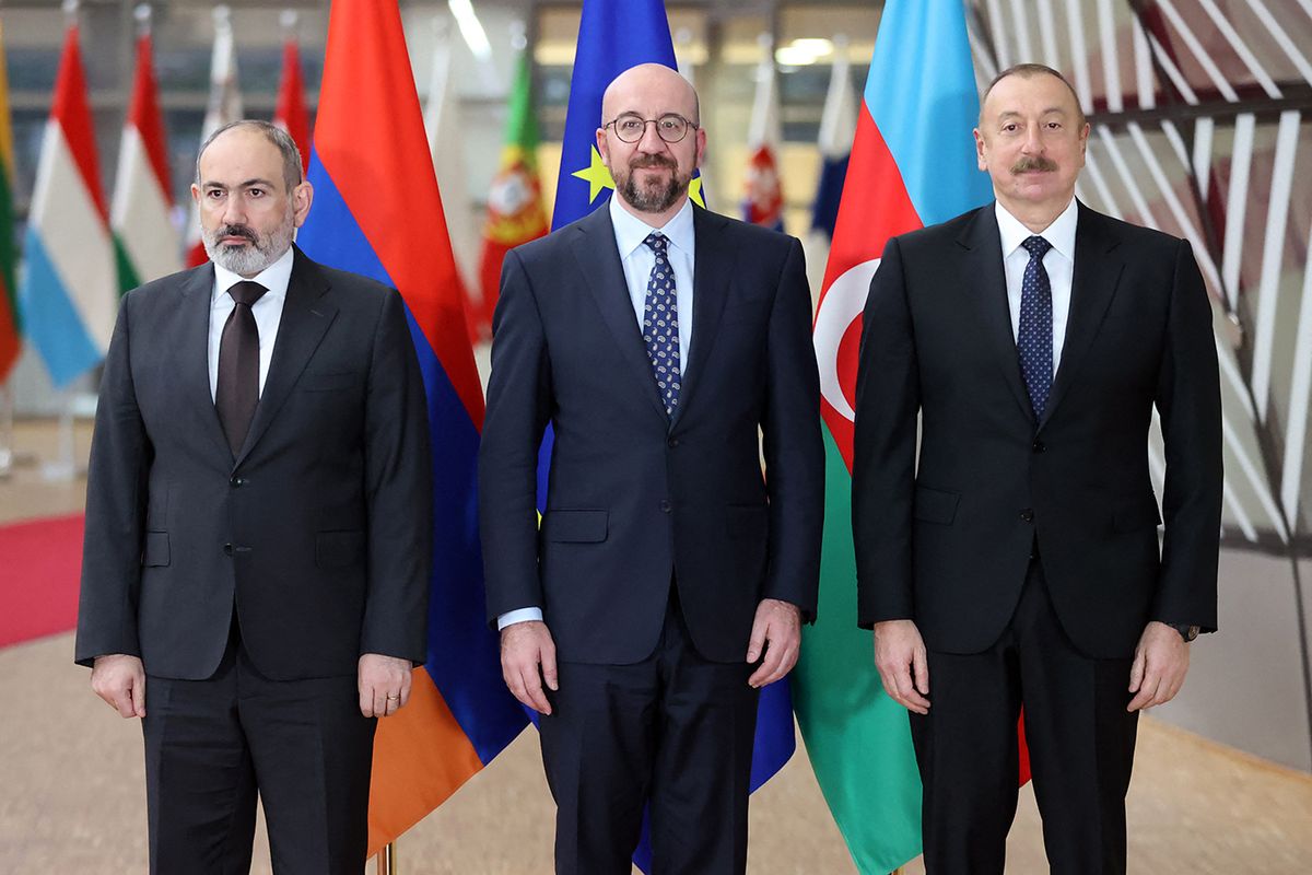BELGIUM-EU-ARMENIA-AZERBAIJAN-KARABAKH-DIPLOMACY-CONFLICT
(From L) Armenian Prime Minister Nikol Pashinyan, President of the European Council Charles Michel, and Azerbaijan's President Ilham Aliyev, pose for an official picture before their meeting at the European Council in Brussels on April 6, 2022, for EU-mediated talks amid renewed tensions over the disputed region of Nagorno-Karabakh. - The Caucasus neighbours, which fought a war in 2020 over Azerbaijan's Armenian-populated enclave, recently expressed readiness to launch negotiations on a "comprehensive peace treaty," following a flare-up in Nagorno-Karabakh this month. (Photo by François WALSCHAERTS / AFP)