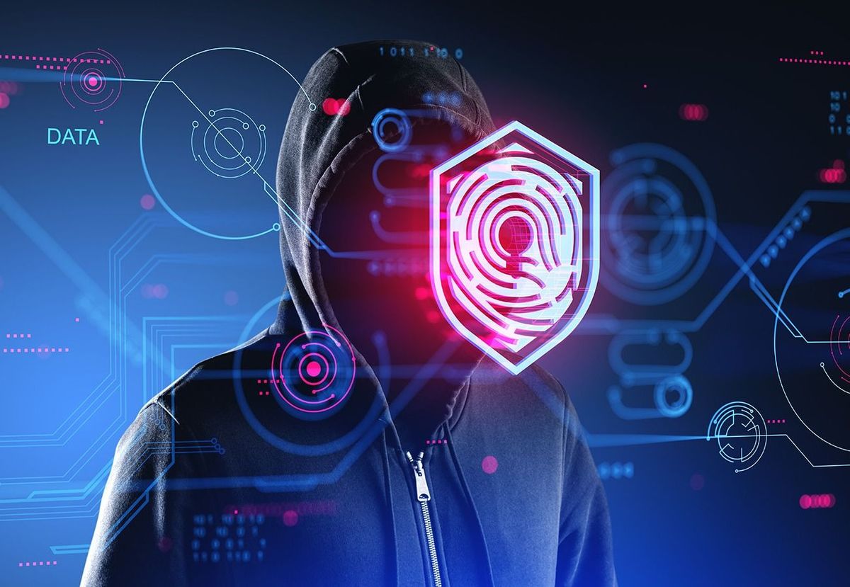 Unrecognizable,Hacker,In,Black,Hoodie,Standing,Over,Dark,Blue,Background
Unrecognizable hacker in black hoodie standing over dark blue background with double exposure of immersive data protection interface. Concept of cyber crime