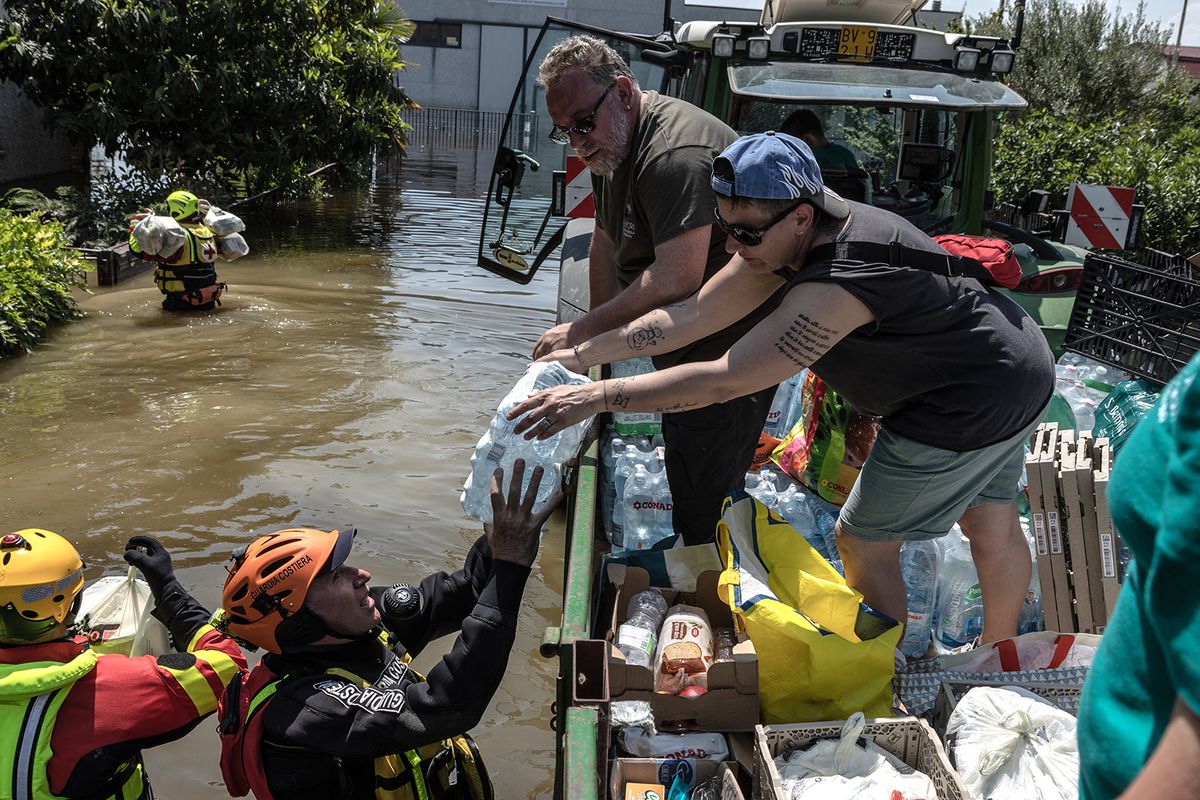 Aftermath of floods in Italy
CONSELICE, ITALY – MAY 23: Volunteers accompany two divers from the Italian Coast Guard and two volunteers from the Italian Red Cross to deliver cooked meals and drinking water to families isolated by flooding in Conselice, Emilia Romagna on May 23, 2023 . Andrea Carrubba / Anadolu Agency (Photo by Andrea Carrubba / ANADOLU AGENCY / Anadolu Agency via AFP)