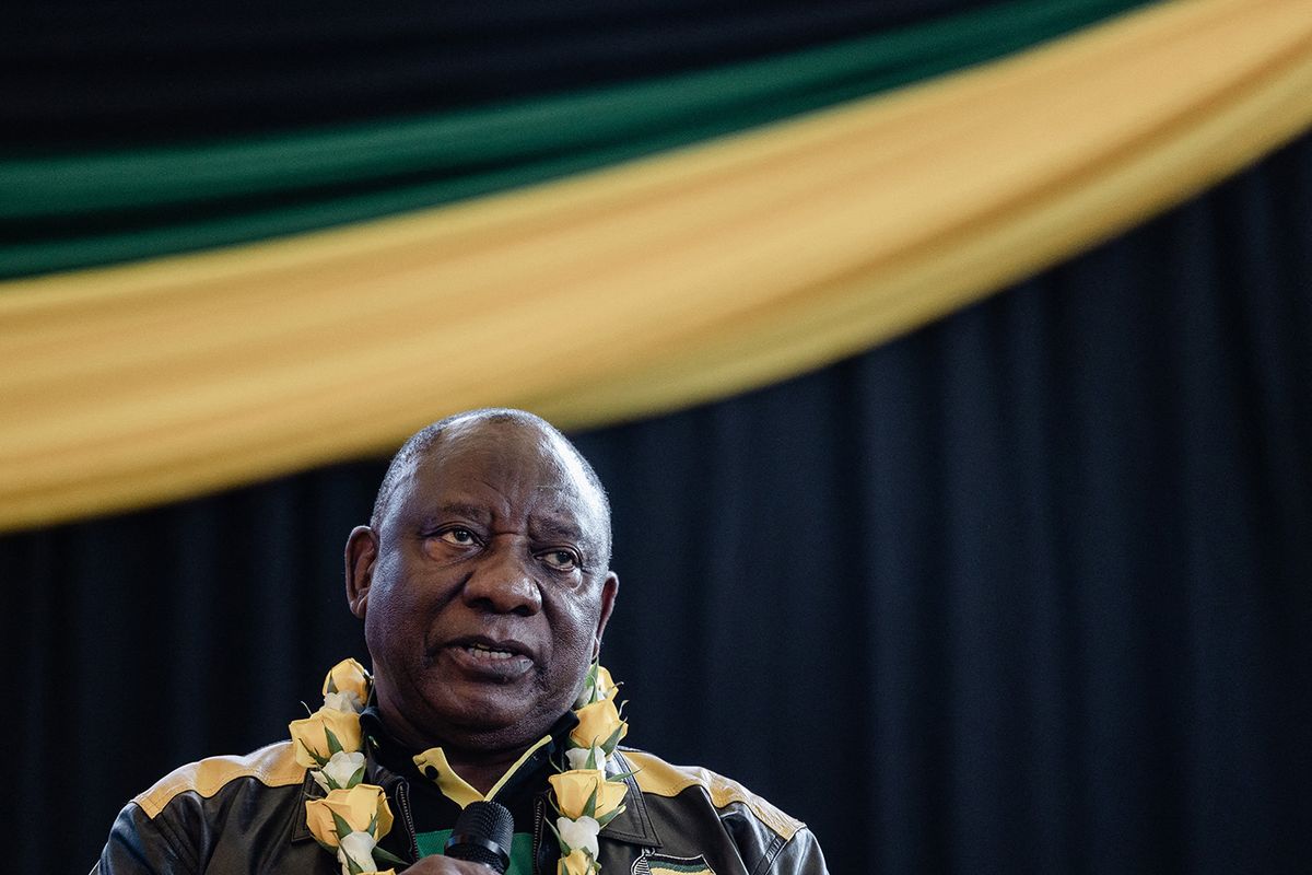 South African President Cyril Ramaphosa addresses new members of the African National Congress (ANC) during an election campaign ahead of the 2024 general elections, at the Nelson Mandela Community Youth Centre in Chatsworth township, north of Durban, on May 14, 2023. 127 members of opposition party Democratic Alliance (DA) joined the ANC ahead of the general elections in 2024. The ANC has lost no less than 13 wards in the last one year. (Photo by Rajesh JANTILAL / AFP)