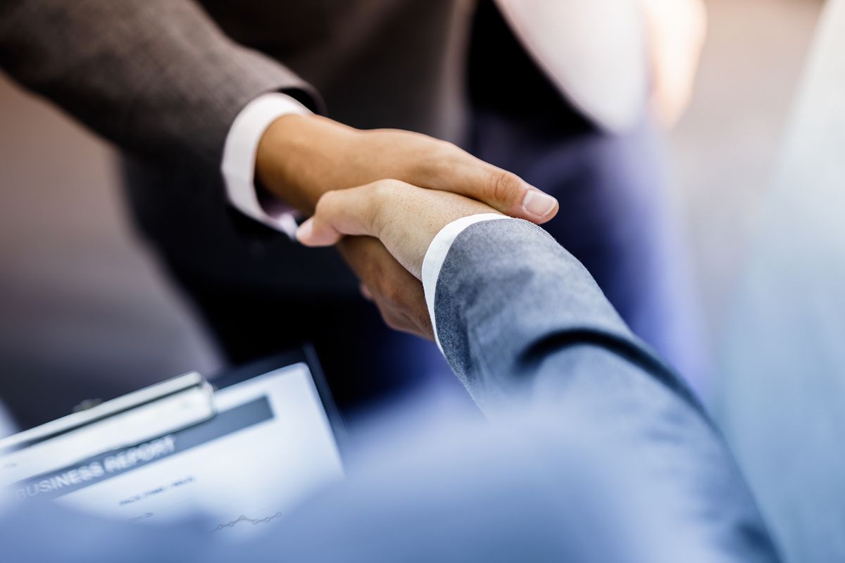 Businessman,Shaking,Hands,To,Seal,A,Deal,With,His,Partner
businessman shaking hands to seal a deal with his partner