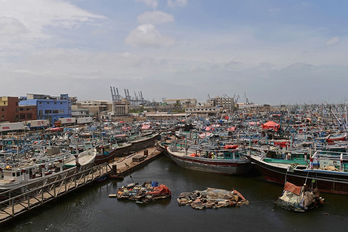 Fishing boats are moored at Karachi port as a part of precautionary measures before the due onset of cyclone, in Karachi on June 14, 2023. More than 40,000 people have been evacuated across India and Pakistan as a cyclone approaches their coast, officials said on June 13, with gales of up to 150 kilometres per hour predicted. (Photo by ASIF HASSAN / AFP)PAKISTAN-CYCLONE-WEATHER