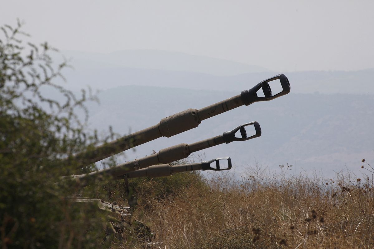 Israeli self-propelled artillery guns are positioned near the Lebanese border on the outskirts of the northern Israeli town of Kiryat Shemona on September 1, 2019. Tensions between the two rival countries have soared, after Lebanon accused Israel of targeting a stronghold of the Shiite Muslim Hezbollah movement with explosive-laden drones last week. (Photo by JALAA MAREY / AFP)ISRAEL-LEBANON-CONFLICT