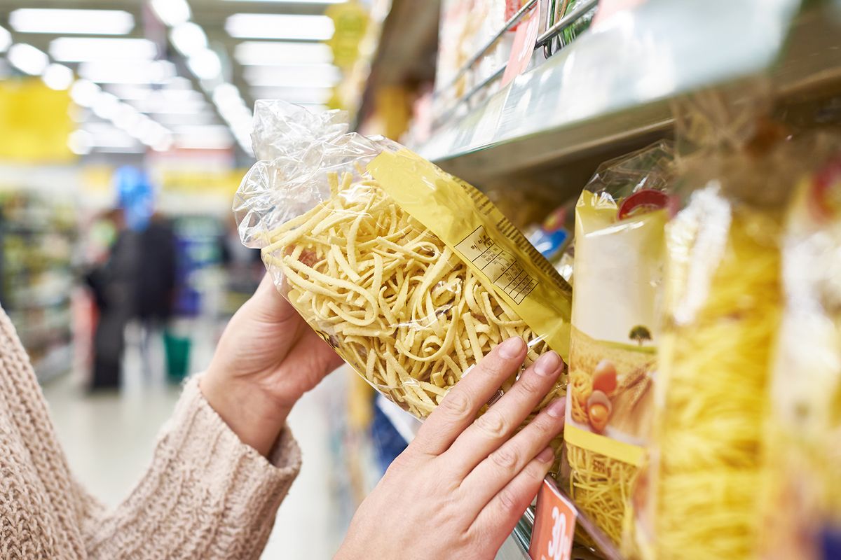 Pack,Of,Pasta,In,The,Hands,Of,The,Buyer,At
Pack of pasta in the hands of the buyer at the store