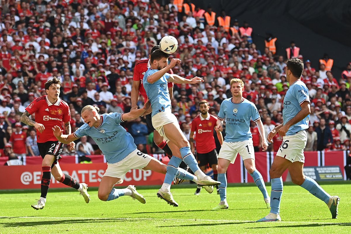 775981944
Manchester City's Portuguese defender Ruben Dias wins a header during the English FA Cup final football match between Manchester City and Manchester United at Wembley stadium, in London, on June 3, 2023. (Photo by Glyn KIRK / AFP) / NOT FOR MARKETING OR ADVERTISING USE / RESTRICTED TO EDITORIAL USE