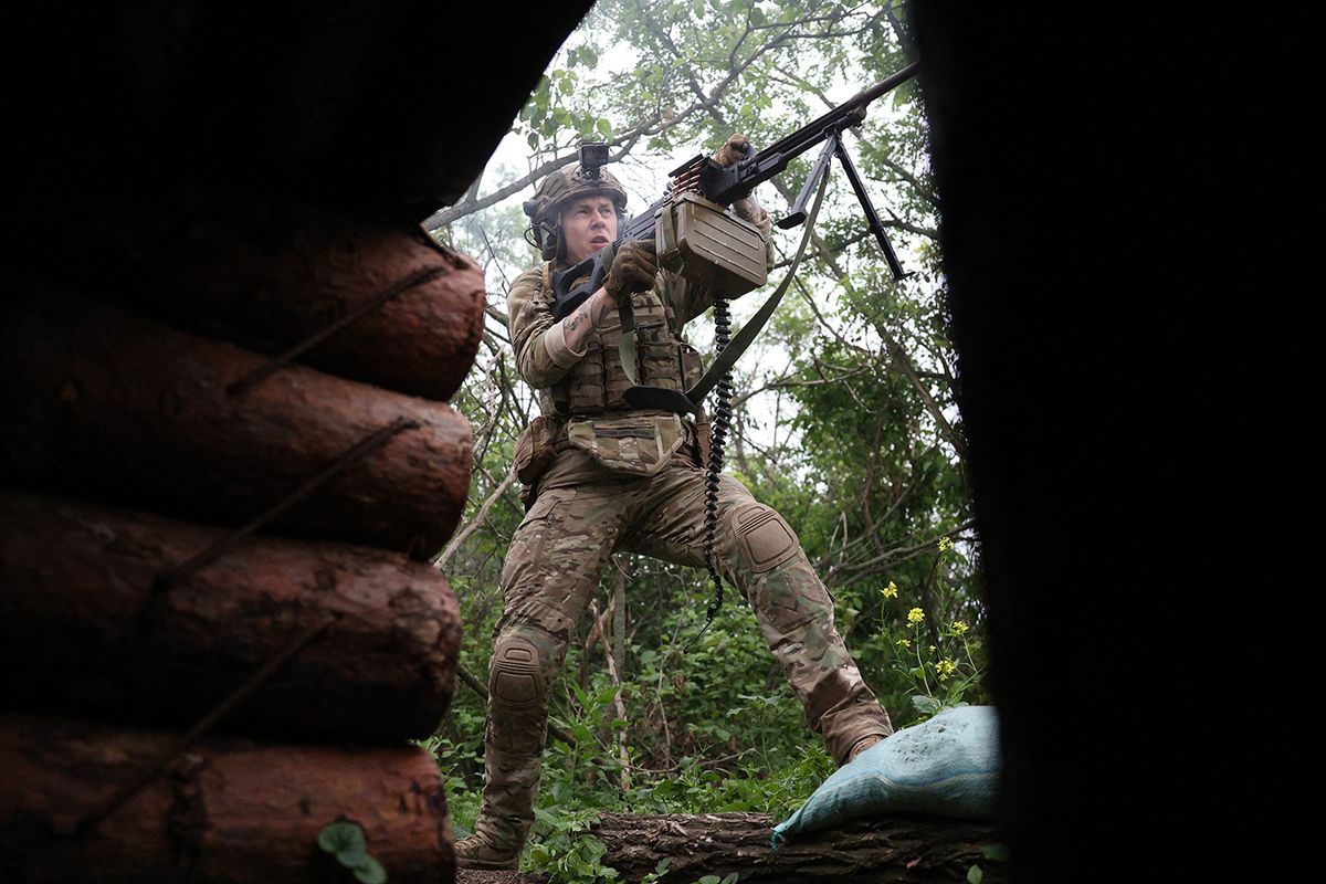 UKRAINE-RUSSIA-CONFLICT-WAR
A Ukrainian soldier of the 28th Separate Mechanized Brigade fires towards Russian positions at the front line near the town of Bakhmut, Donetsk region, on June 17, 2023, amid the Russian invasion of Ukraine. (Photo by Anatolii STEPANOV / AFP)