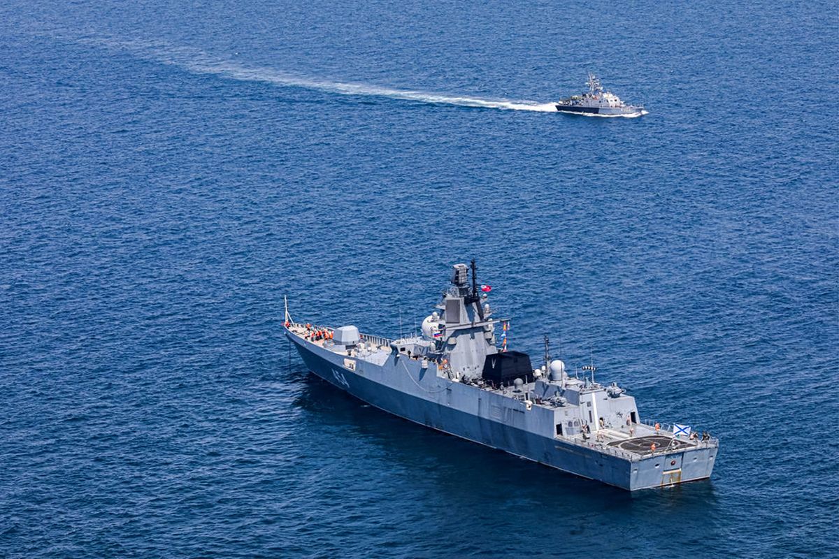 IRAN-RUSSIA-CHINA-DEFENCE-MILITARY-DRILLSThis handout picture provided by the Iranian Army office on March 15, 2023 shows a view of the (bottom) Russian Navy frigate Admiral Gorshkov (454) during joint naval military drills between Iran, Russia, and China in the Gulf of Oman. (Photo by Iranian Army office / AFP) / === RESTRICTED TO EDITORIAL USE - MANDATORY CREDIT "AFP PHOTO / HO / IRANIAN ARMY OFFICE" - NO MARKETING NO ADVERTISING CAMPAIGNS - DISTRIBUTED AS A SERVICE TO CLIENTS === 