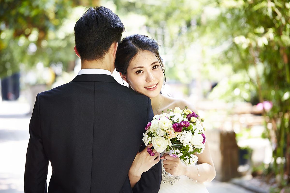 Portrait,Of,Young,Asian,Bride,And,Groom,At,Wedding,Ceremony.