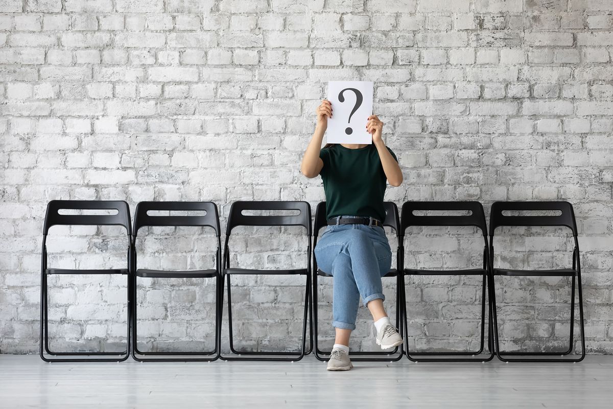 Young,Female,Job,Applicant,Sit,On,Chair,In,Corridor,Hide