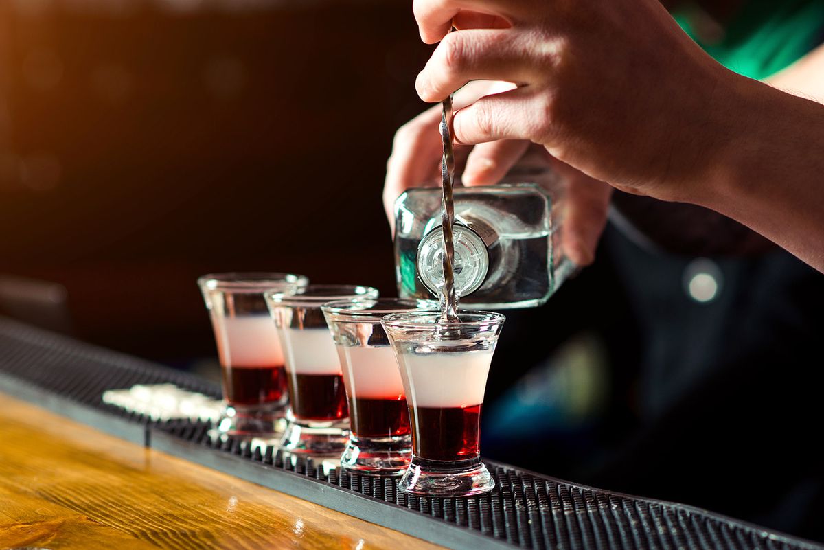 Barman,Make,Alcoholic,Shots,In,Nightclub.,Strong,Alcoholic,Drink.,Multicolored
Barman make alcoholic shots in nightclub. Strong alcoholic drink. Multicolored shots on the bar. Small glasses with alcoholic drinks at bar counter. Party at nightclub