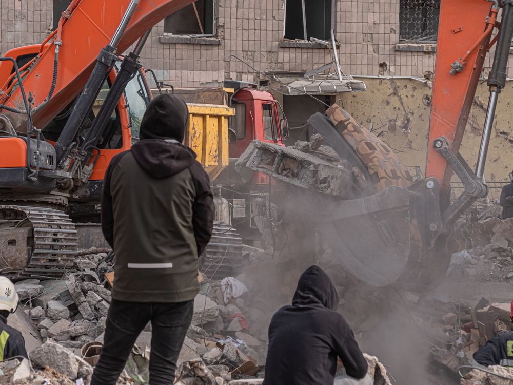 Borodyanka,,Ukraine,-,April,2022:,Bulldozer,Clears,Debris,In,Search