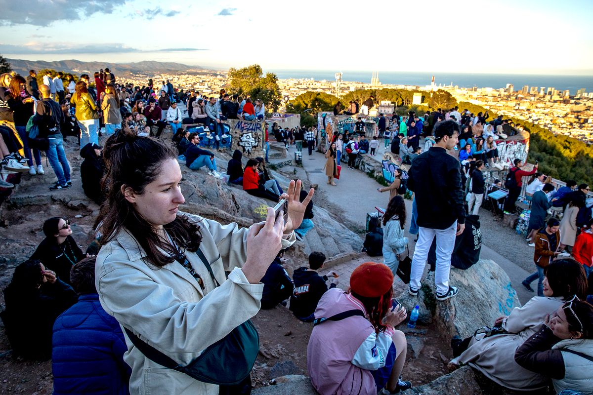 Tourism Massification In The Former Barcelona Anti-aircraft Defenses.
Since its appearance in the tourist guides, the former locations of the Barcelona air defences have become a daily meeting point for thousands of visitors. The best 360-degree view of the city means that every evening and night the youngest tourists meet, to observe the sunset while watching some beers. This causes anxiety and inconvenience to neighbours accustomed to a quiet life, and the presence of urban police and painted against tourist massification, with the slogan 'tourist, go home', is already common. Barcelona returns from the tourist massification, after the truce that represented the stoppage of the activities of the COVID-19 pandemic. In Barcelona, Catalonia, Spain, 4 April 2023. (Photo by Albert Llop/NurPhoto) (Photo by Albert Llop / NurPhoto / NurPhoto via AFP)