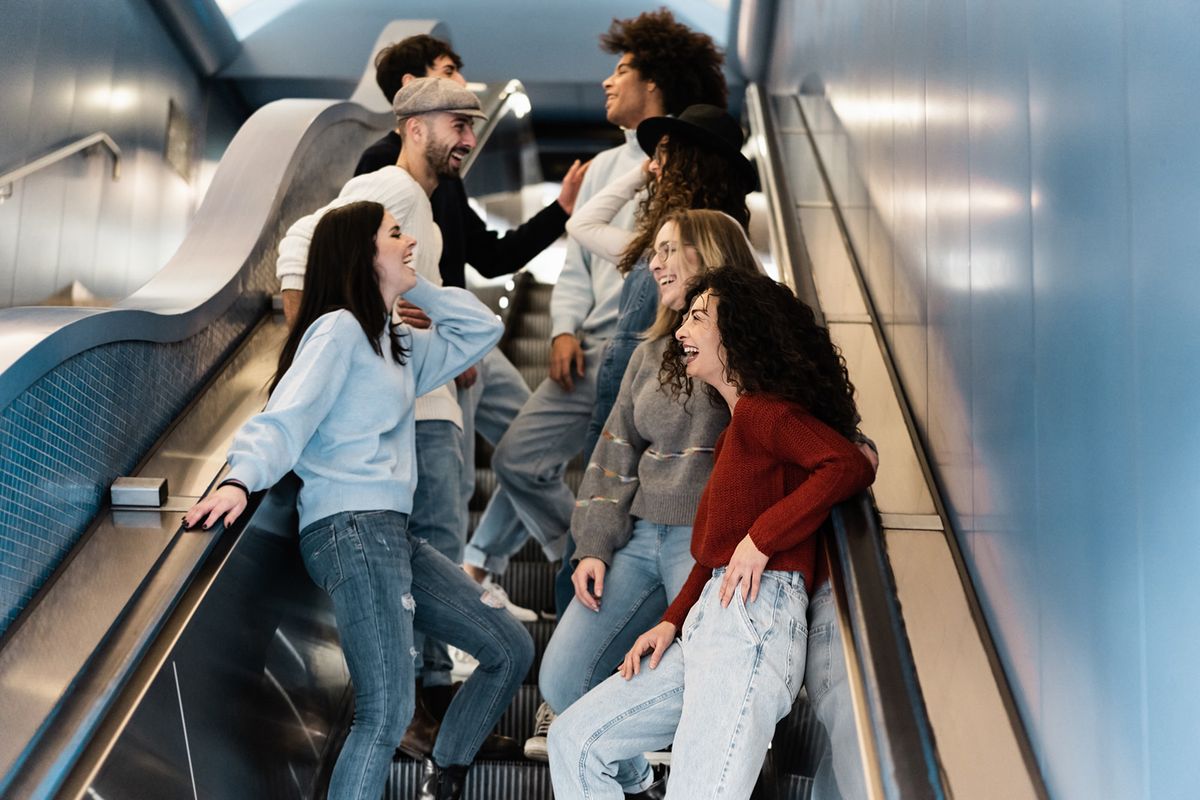 Happy,Group,Of,Friends,Having,Fun,Together,On,Subway,Metro
Happy group of friends having fun together on subway metro stairs - Soft focus on bottom right girl