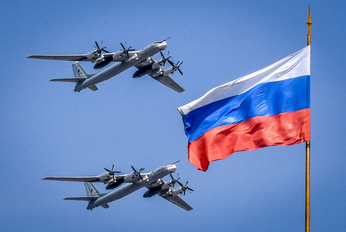 Russian Tupolev Tu-95 turboprop-powered strategic bombers fly above the Kremlin during a rehearsal for the Victory Day military parade in Moscow on May 4, 2018. Russia celebrates the 73rd anniversary of the 1945 victory over Nazi Germany on May 9. (Photo by Yuri KADOBNOV / AFP)