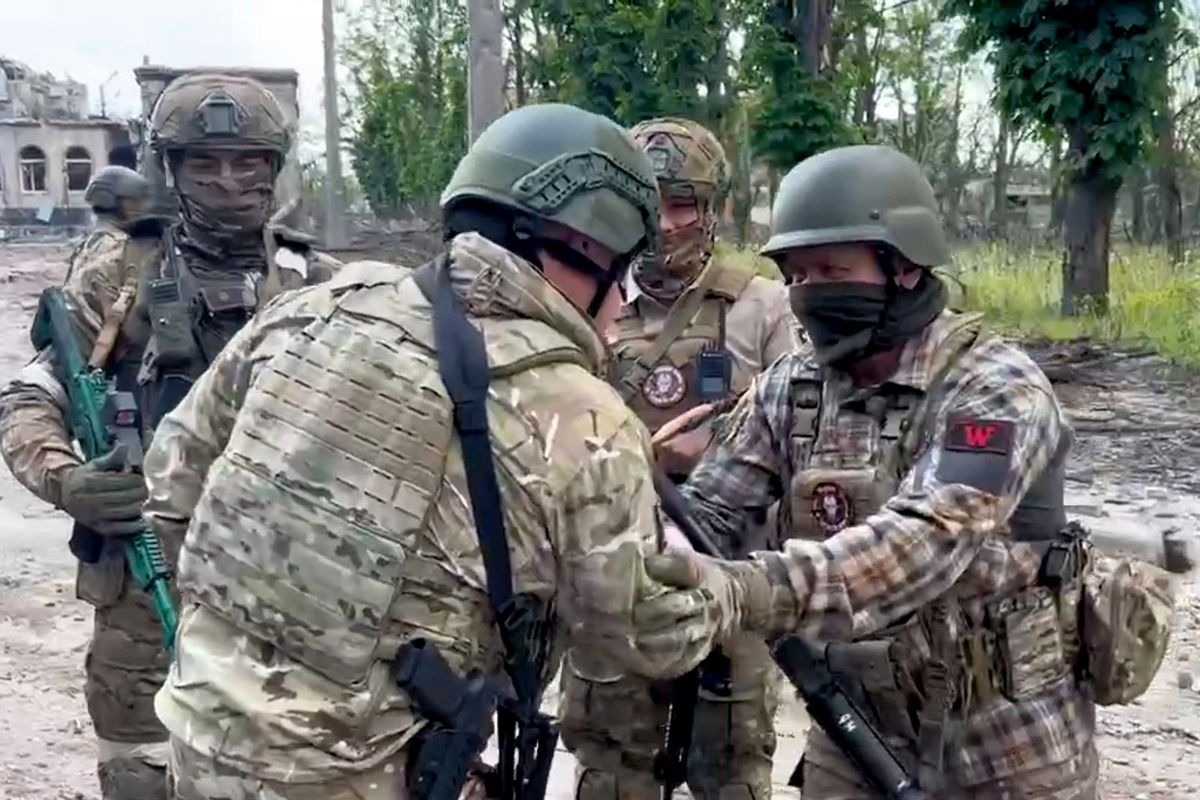 WAGNER
This video grab taken from a handout footage posted on May 20, 2023 on the Telegram account of the press service of Concord -- a company linked to the chief of Russian mercenary group Wagner, Yevgeny Prigozhin -- shows Yevgeny Prigozhin (2-L) shaking hands with his soldiers in Bakhmut, amid the Russian invasion of Ukraine. Russia's private army Wagner claimed on May 20, 2023, the total control of the east Ukrainian city of Bakhmut, the epicentre of fighting, as Kyiv said the battle was continuing but admitted the situation was "critical". Bakhmut, a salt mining town that once had a population of 70,000 people, has been the scene of the longest and bloodiest battle in Moscow's more than year-long Ukraine offensive. The fall to Russia of Bakhmut, where both Moscow and Kyiv are believed to have suffered huge losses, would have high symbolic value. (Photo by Handout / various sources / AFP) / RESTRICTED TO EDITORIAL USE - MANDATORY CREDIT "AFP PHOTO /  Telegram channel of Concord group" - NO MARKETING - NO ADVERTISING CAMPAIGNS - DISTRIBUTED AS A SERVICE TO CLIENTS
