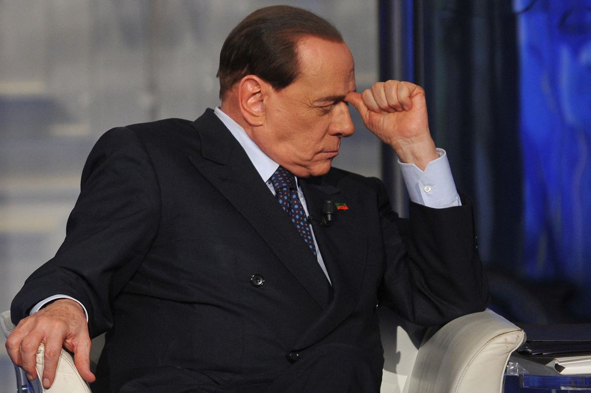 Former Italian Prime Minister Silvio Berlusconi attends the RAI 1 television programme "Porta a Porta" on April 24, 2014 in Rome. Silvio Berlusconi officially signed up to his community service yesterday, agreeing to a court document which lays down the rules for his punishment for tax fraud.  "I signed the document," the 77-year-old billionaire tycoon told crowds of journalists at a court office in Milan after finding out the details of his imminent community service in a Catholic Church-run old people's home. The punishment is due to last around 10 months.  AFP PHOTO / TIZIANA FABI (Photo by Tiziana FABI / AFP)